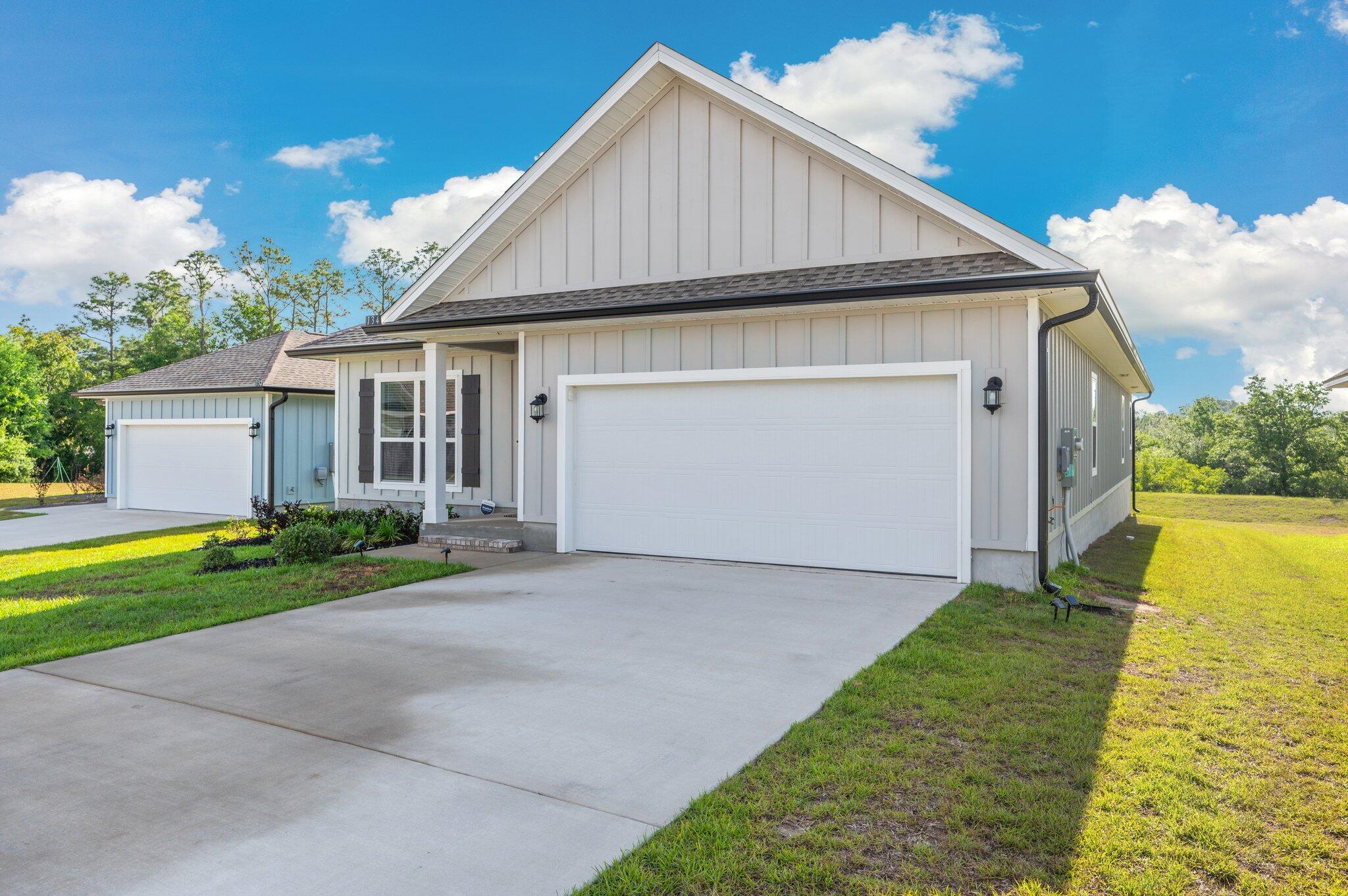 134 Blooming Cove Crestview, FL 32539 - Photo 3 of 50 a view of house with garden and garage