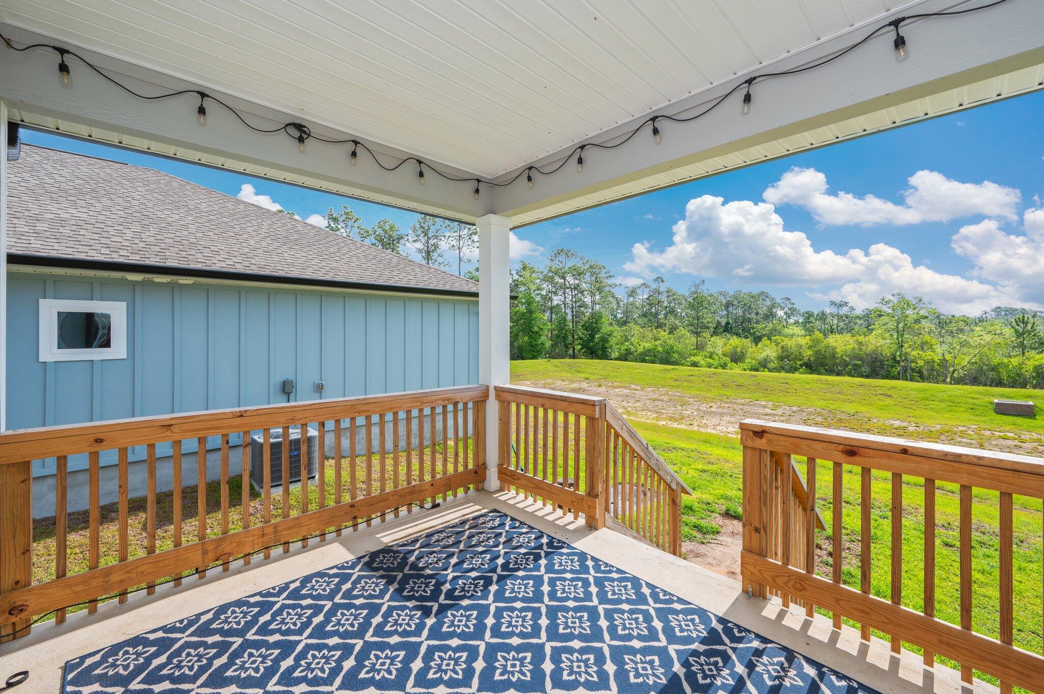 134 Blooming Cove Crestview, FL 32539 - Photo 42 of 50 a view of a balcony with wooden floor