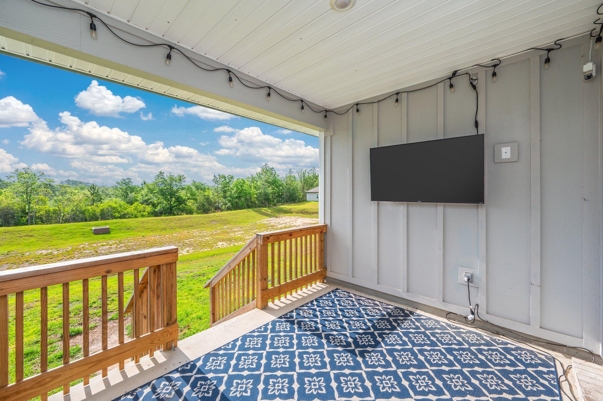 134 Blooming Cove Crestview, FL 32539 - Photo 43 of 50 a view of a balcony with wooden floor and outdoor space