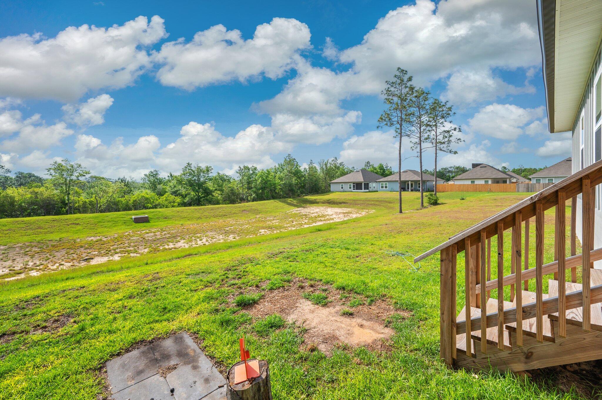 134 Blooming Cove Crestview, FL 32539 - Photo 44 of 50 a view of an ocean house and a yard