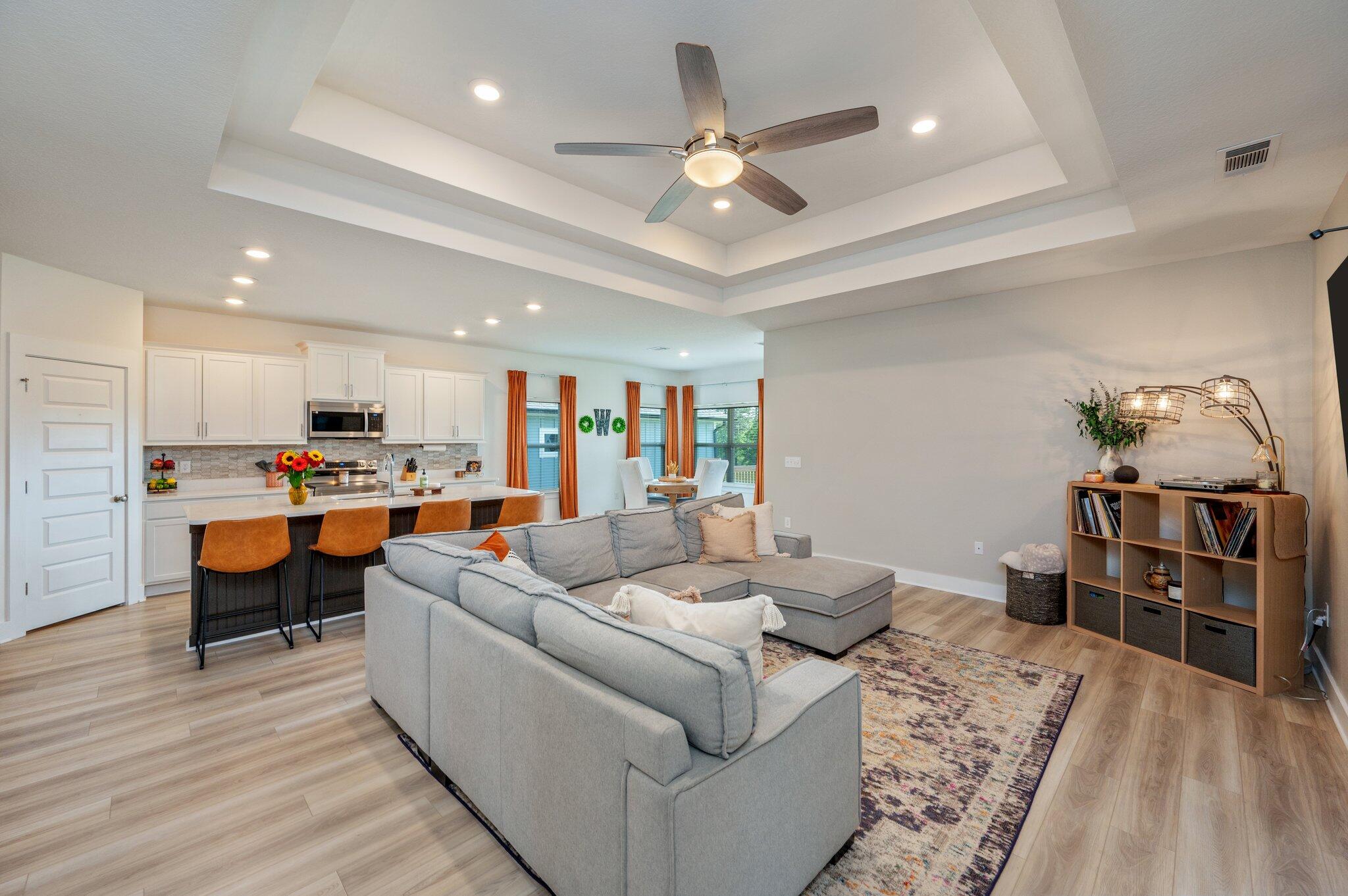 134 Blooming Cove Crestview, FL 32539 - Photo 7 of 50 a living room with furniture kitchen view and a wooden floor