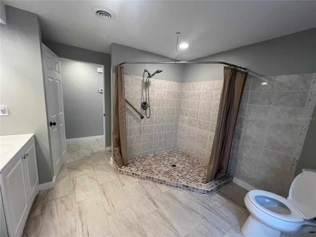 129 Northshore Terrace Punta Gorda, FL 33980 - Photo 13 of 37 a bathroom with a shower and a toilet