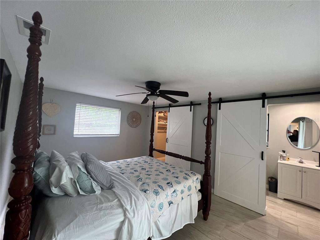 129 Northshore Terrace Punta Gorda, FL 33980 - Photo 15 of 37 a bedroom with a bed and a window