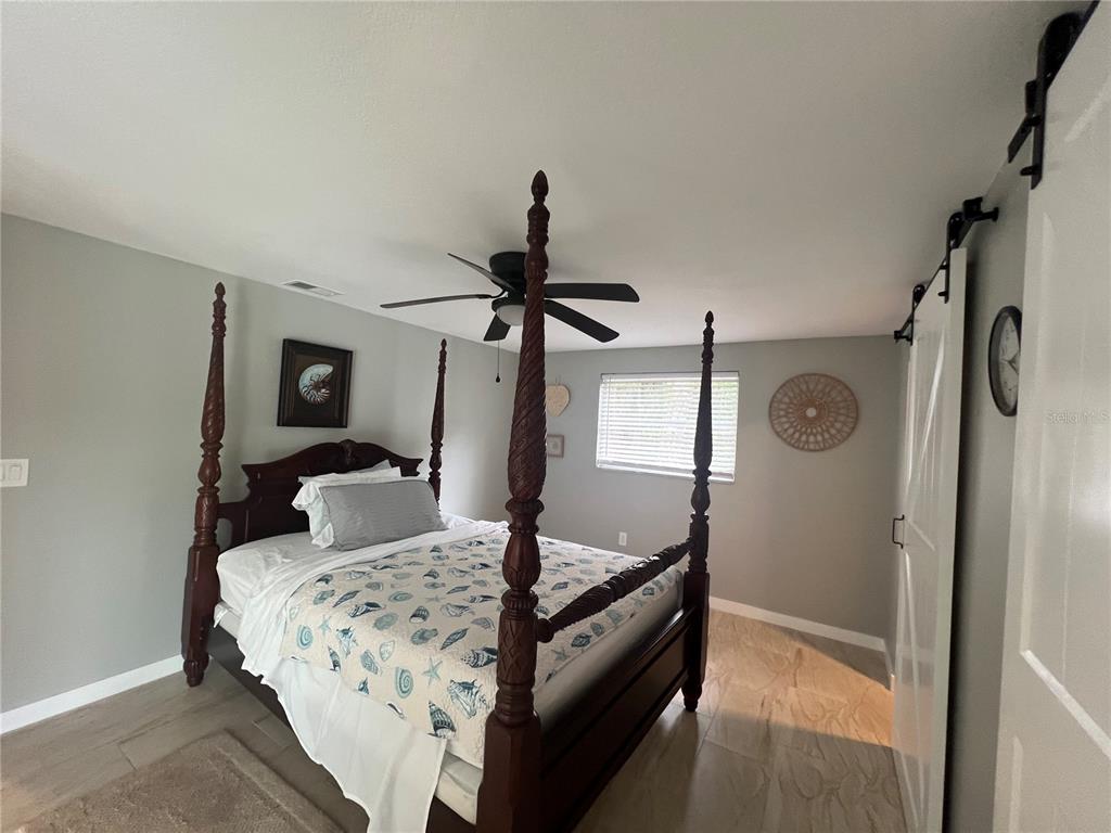 129 Northshore Terrace Punta Gorda, FL 33980 - Photo 16 of 37 a bedroom with a bed and a mirror