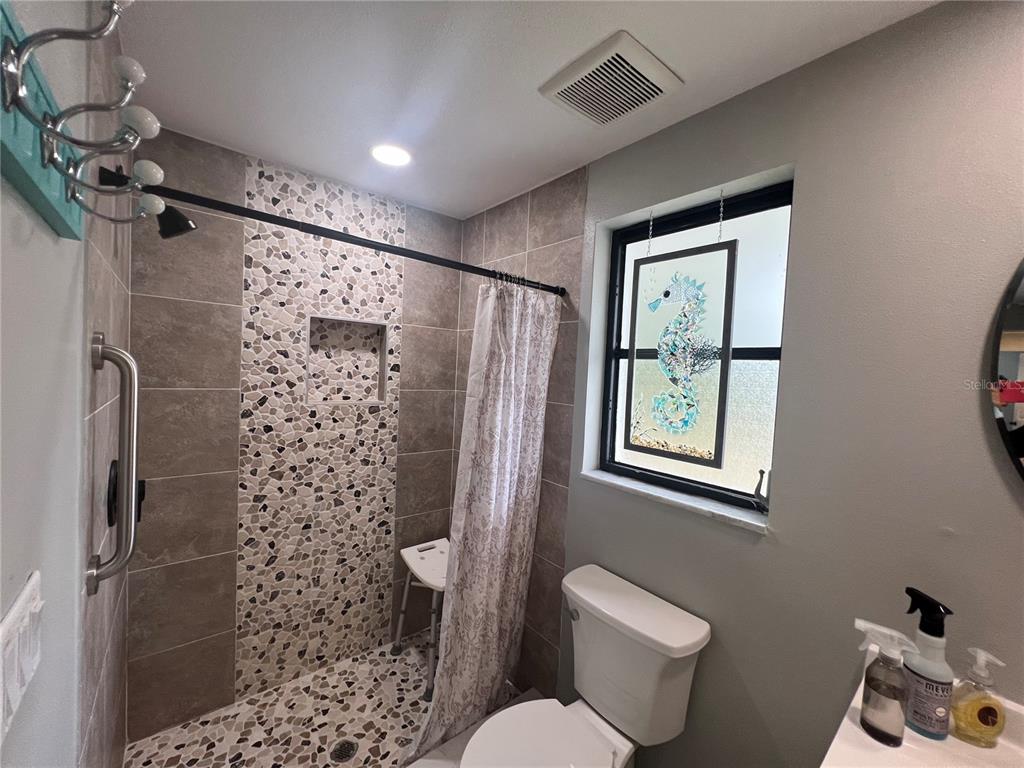 129 Northshore Terrace Punta Gorda, FL 33980 - Photo 18 of 37 a bathroom with a toilet sink and shower