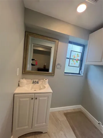 a bathroom with a sink and a mirror