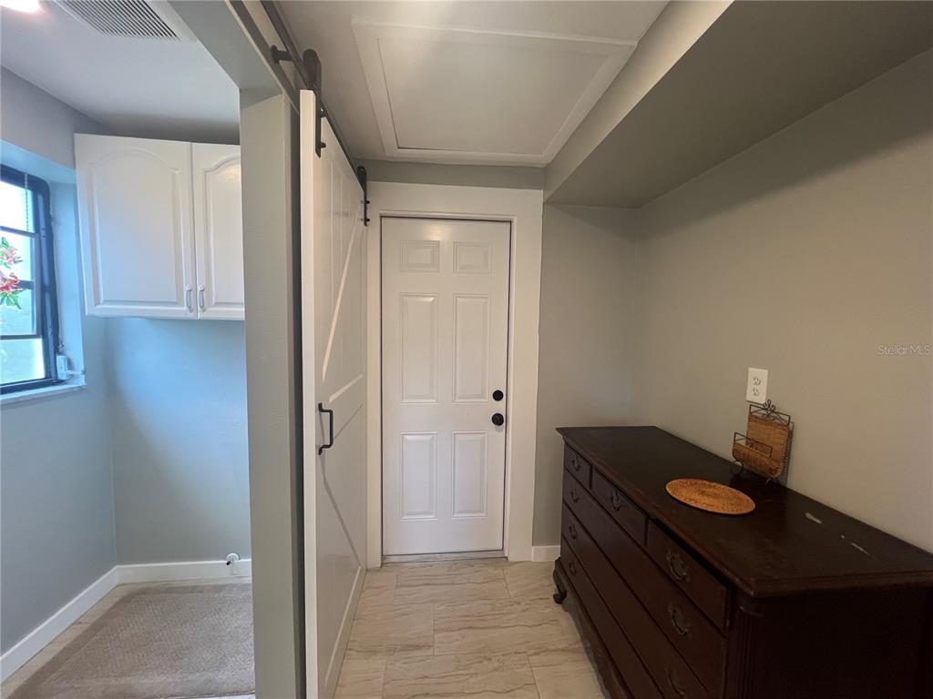 129 Northshore Terrace Punta Gorda, FL 33980 - Photo 23 of 37 a bathroom with a sink a mirror and a shower