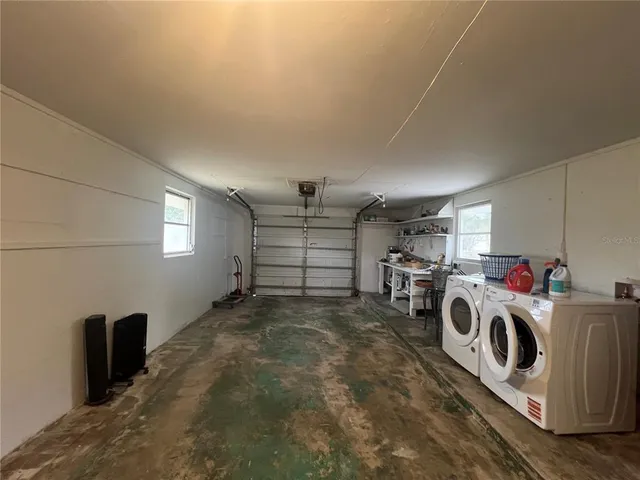 a view of a storage & utility room with washer and dryer