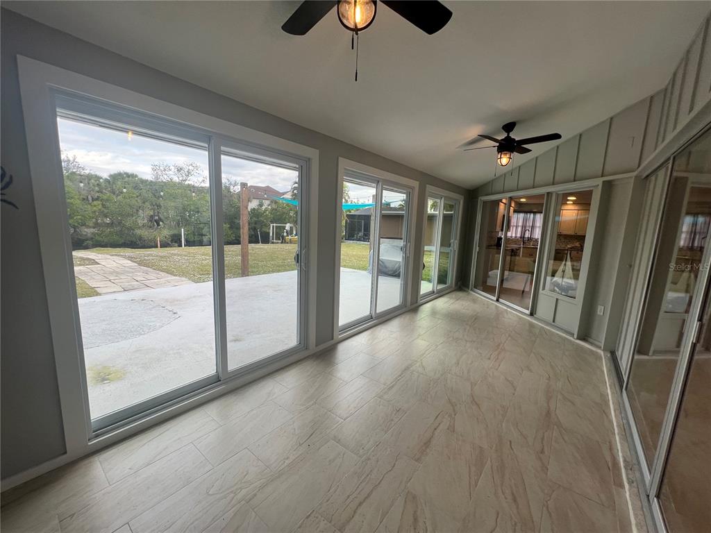 129 Northshore Terrace Punta Gorda, FL 33980 - Photo 26 of 37 a view of an empty room with wooden floor and a window