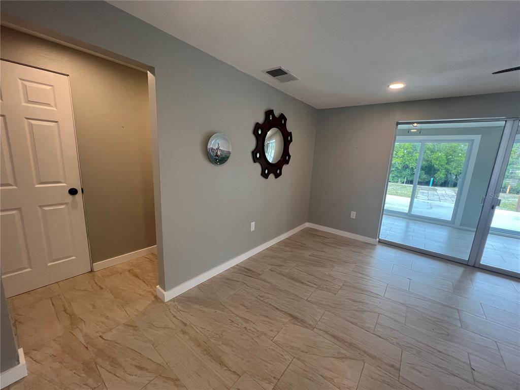 129 Northshore Terrace Punta Gorda, FL 33980 - Photo 3 of 37 wooden floor in an empty room with a window