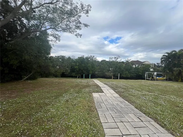 a view of outdoor space with green field and trees