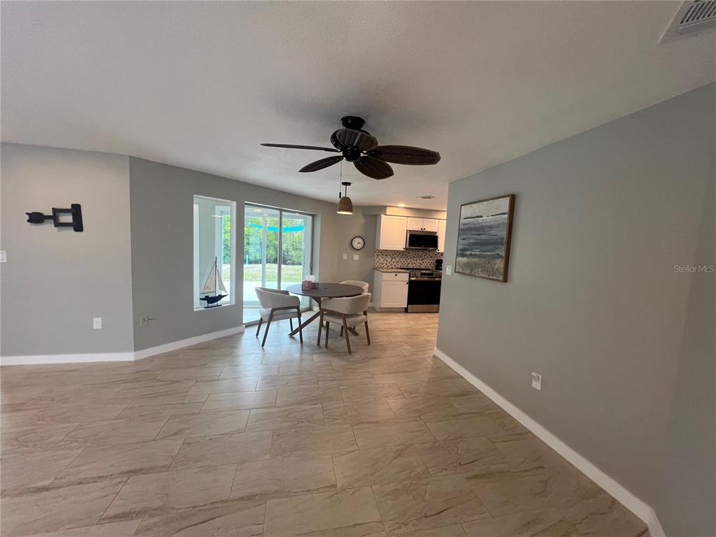 129 Northshore Terrace Punta Gorda, FL 33980 - Photo 5 of 37 a living room with furniture and a large window