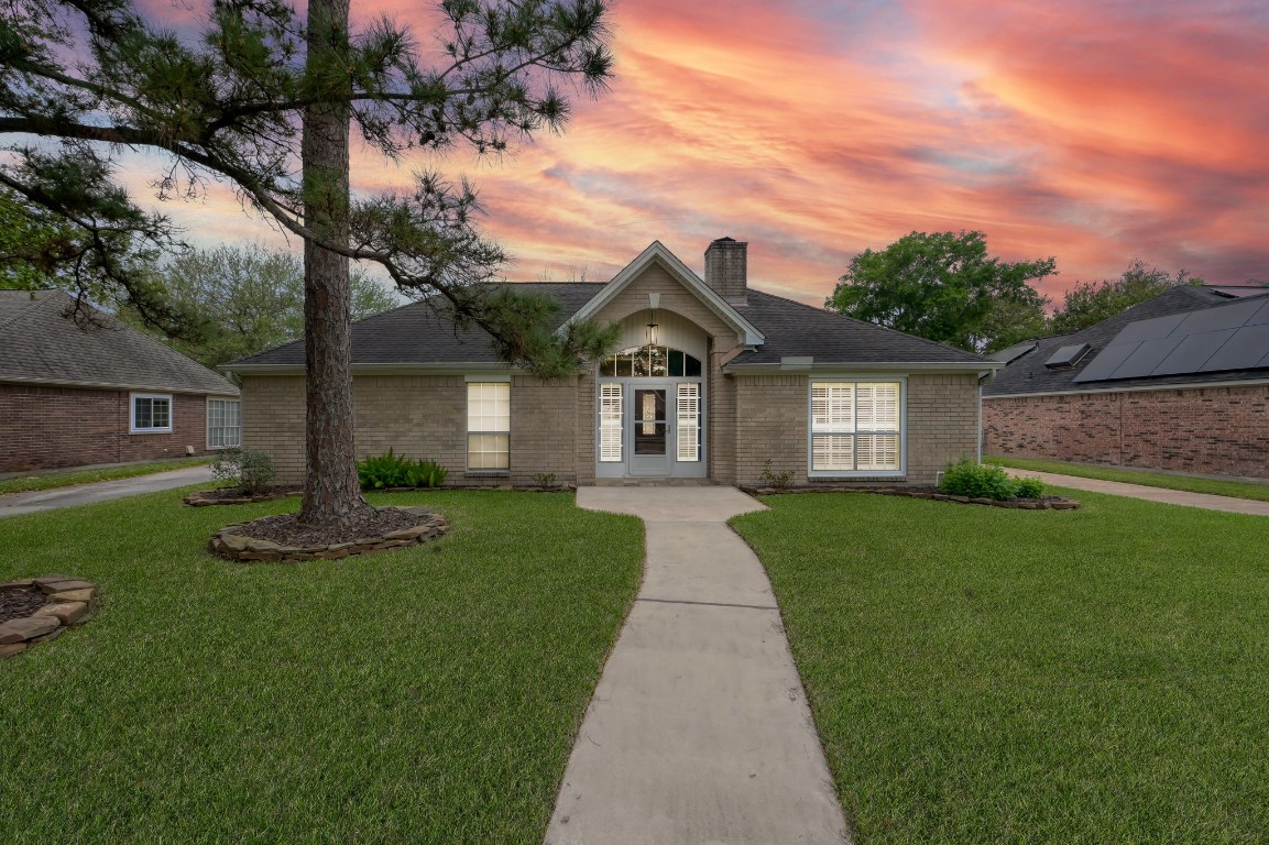 16135 Ridge Park Drive Houston, TX 77095 - Photo 1 of 27 a front view of a house with a yard