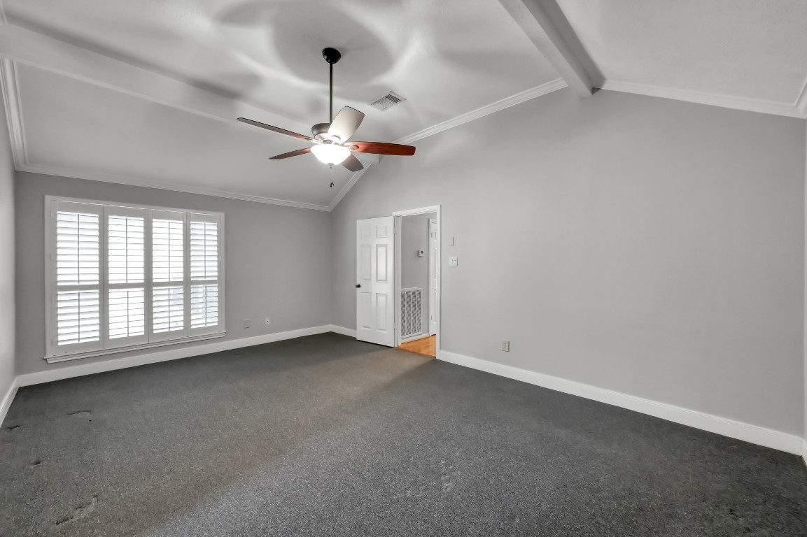 16135 Ridge Park Drive Houston, TX 77095 - Photo 16 of 27 an empty room with a chandelier fan and windows