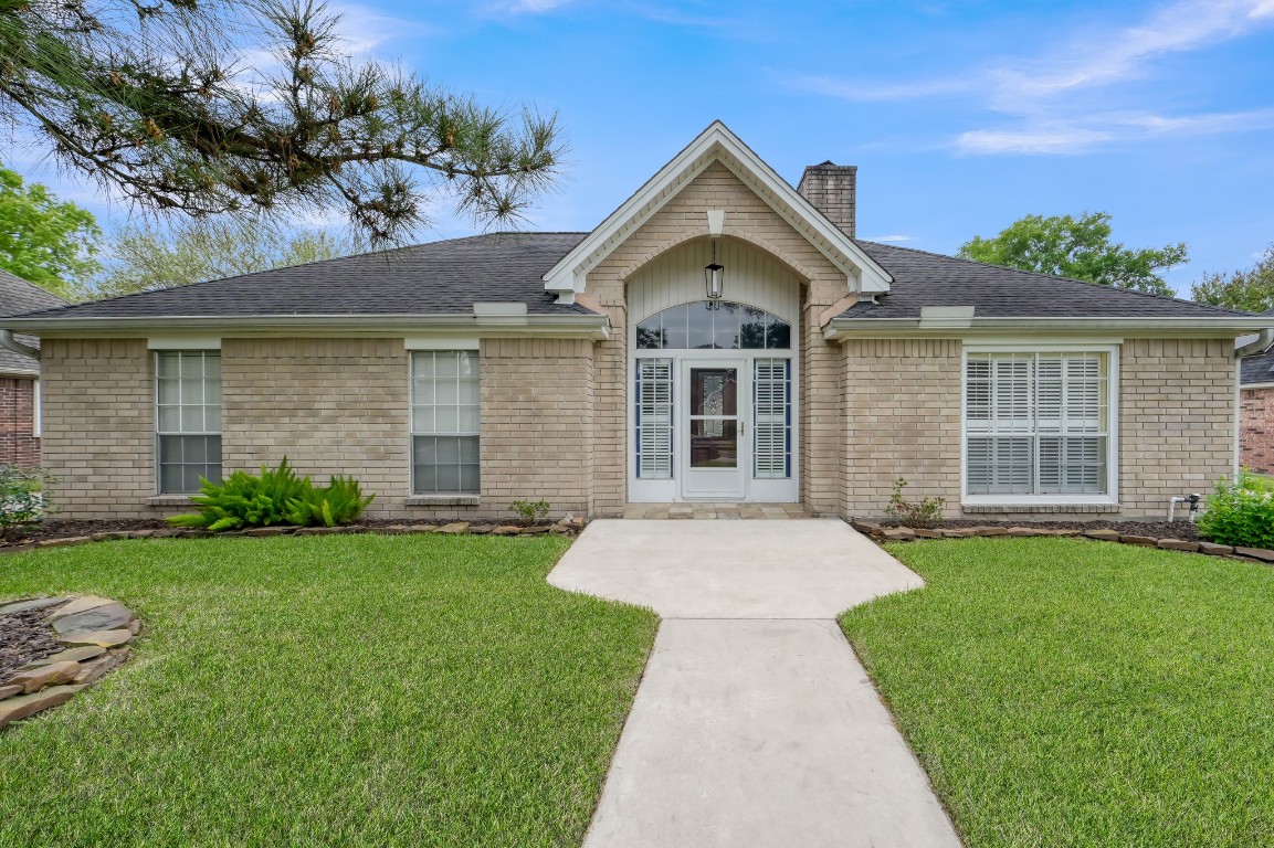 16135 Ridge Park Drive Houston, TX 77095 - Photo 2 of 27 a front view of a house with a yard