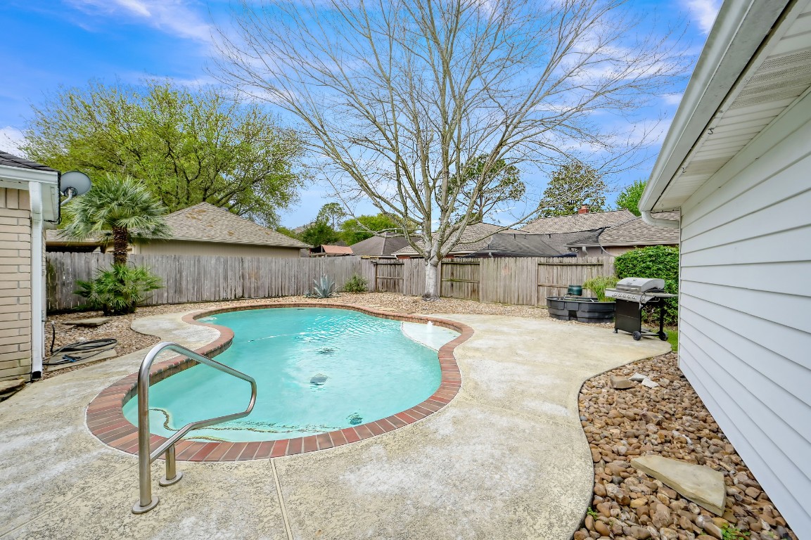 16135 Ridge Park Drive Houston, TX 77095 - Photo 25 of 27 a view of backyard with swimming pool and sitting area