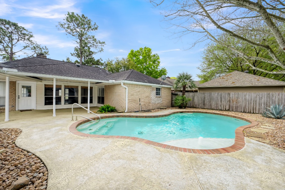 16135 Ridge Park Drive Houston, TX 77095 - Photo 26 of 27 front view of a house with a yard