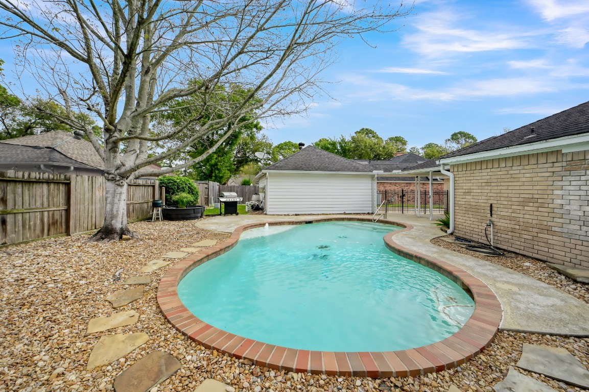 16135 Ridge Park Drive Houston, TX 77095 - Photo 27 of 27 a view of a house with backyard