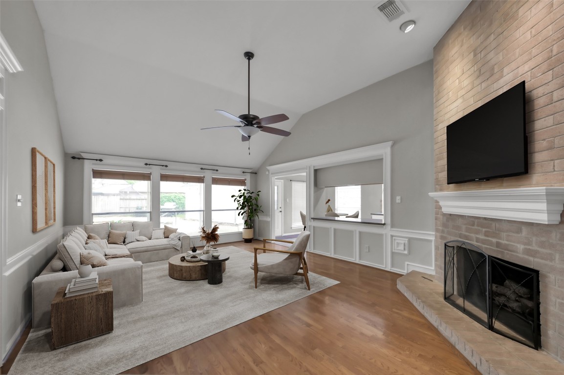 16135 Ridge Park Drive Houston, TX 77095 - Photo 5 of 27 a living room with fireplace furniture and a flat screen tv