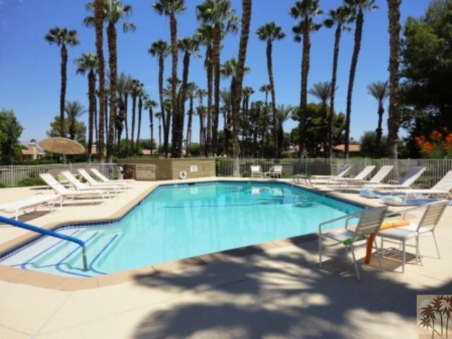 72315 Rodeo Way Rancho Mirage, CA 92270 - Photo 1 of 23 a view of a swimming pool with lounge chairs