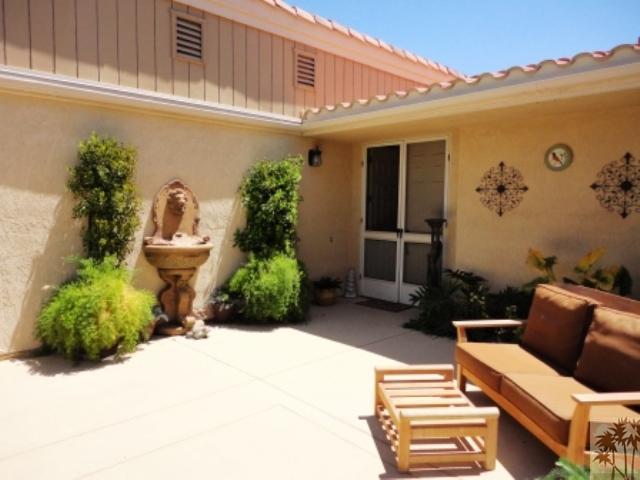 72315 Rodeo Way Rancho Mirage, CA 92270 - Photo 3 of 23 a view of a chairs and table in backyard