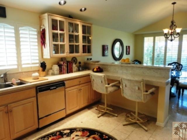 72315 Rodeo Way Rancho Mirage, CA 92270 - Photo 8 of 23 a view of a kitchen with a sink and cabinets