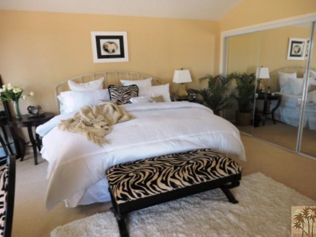 72315 Rodeo Way Rancho Mirage, CA 92270 - Photo 10 of 23 a bedroom with a bed and potted plant