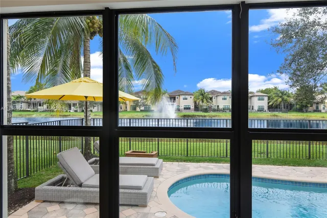 a view of a patio with a table and chairs