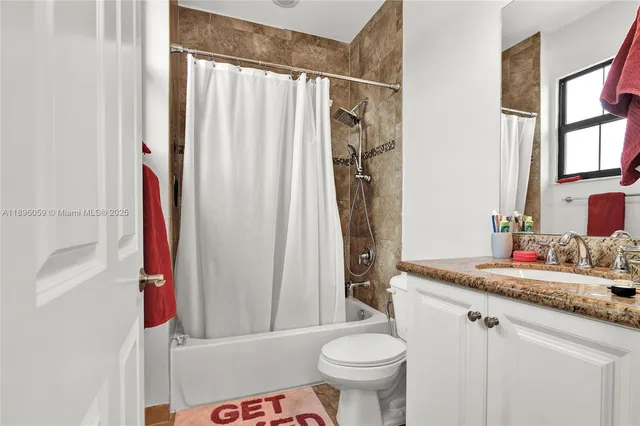 a utility room with sink dryer and washer