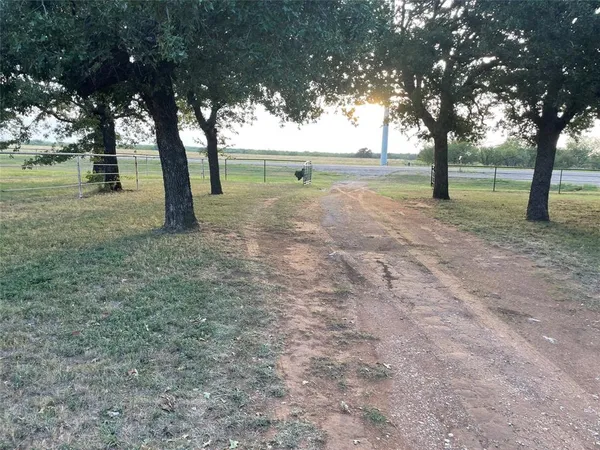 a view of outdoor space with deck and trees