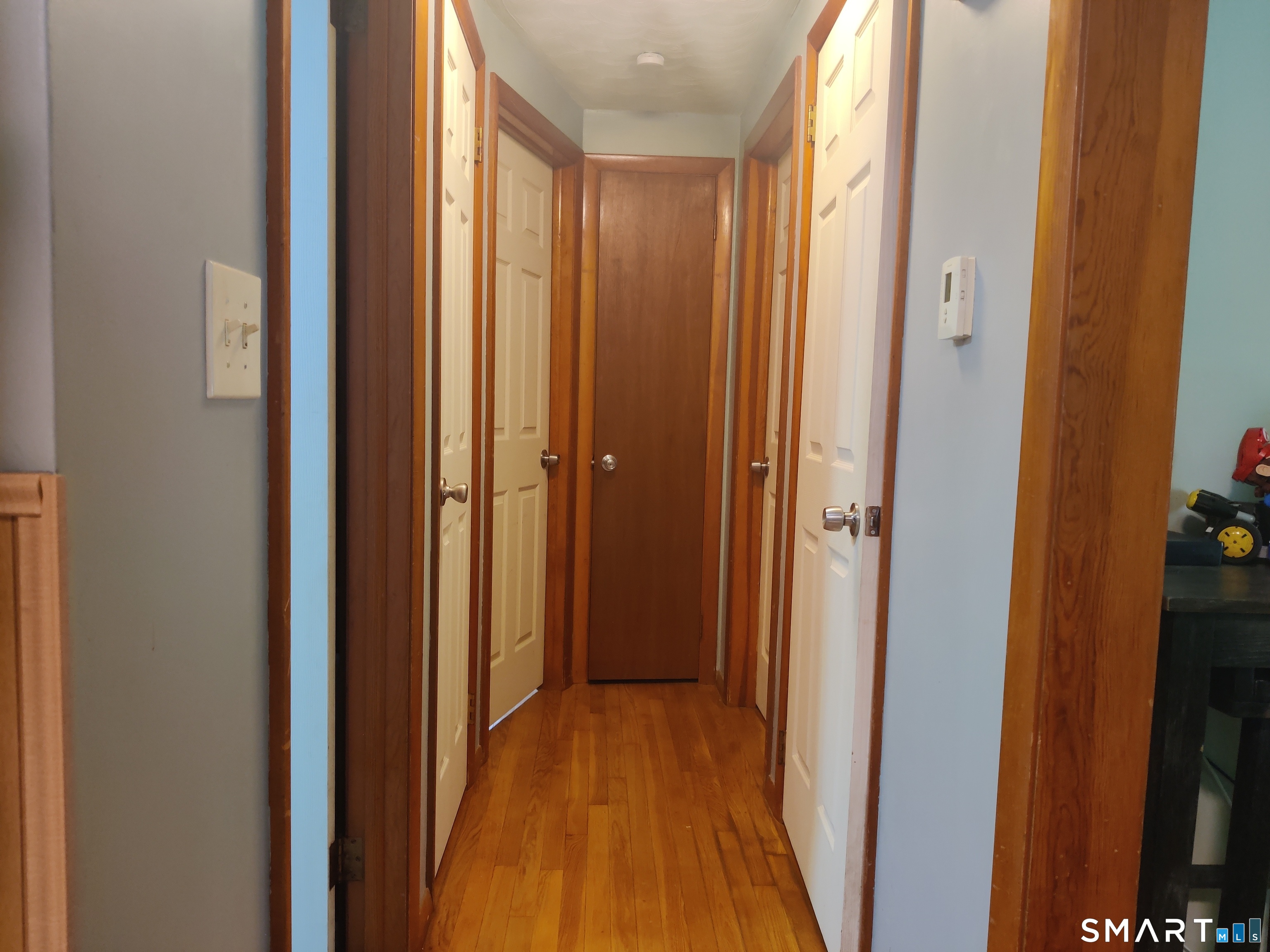 35 Brook Road Enfield, CT 06082 - Photo 7 of 25 a view of a hallway with wooden floor
