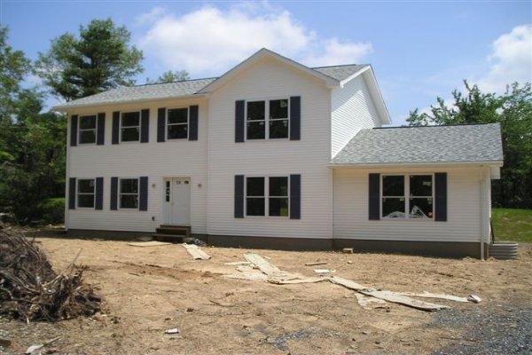 5646 Clover Road Long Pond, PA 18334 - Photo 1 of 12 a front view of a house with a yard