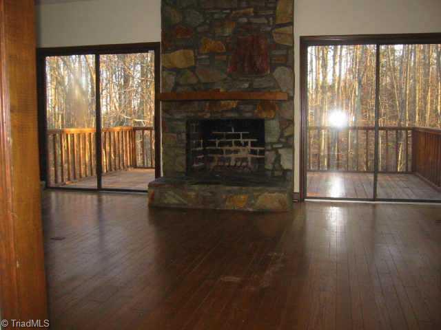 5750 Loop Road Clemmons, NC 27012 - Photo 1 of 9 Exterior Front. GreatRoom with large Rock fireplace and Vaulted ceiling overlooks beautiful entertaing area with patio and in-groud pool.