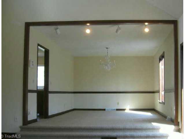 5750 Loop Road Clemmons, NC 27012 - Photo 2 of 9 Other. Huge formal Dining Room overlooks wooded backyard and pool area.