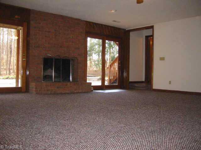 5750 Loop Road Clemmons, NC 27012 - Photo 4 of 9 Other. Tremendous Lower Level Den With large fireplace opens to patio and pool area (20 4 X 20 2) & high ceilings.(Very immense & open feeling to these rooms)