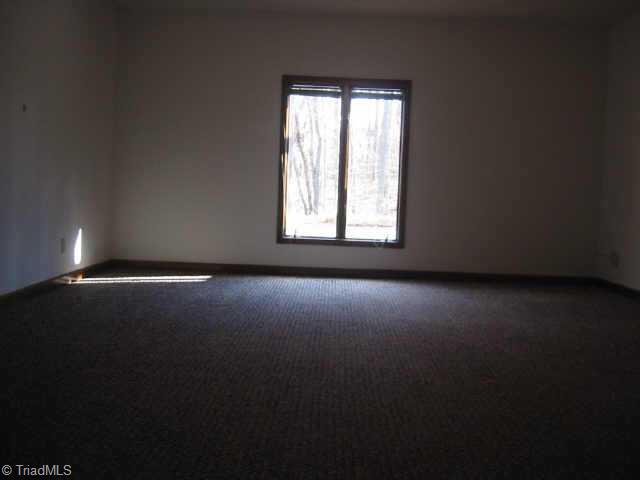 5750 Loop Road Clemmons, NC 27012 - Photo 5 of 9 Other. Very large Excercise Room (21 X 16 7 ) also looks out onto wooded back yard and pool/patio area.