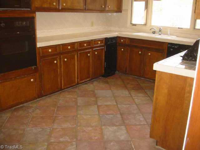 5750 Loop Road Clemmons, NC 27012 - Photo 7 of 9 Other. Great Kitchen w/tile floors and ceramic tile back splashes(look closely at picture)same tile is in Entry Foyer and Breakfast Room.No room in MLS system to diplay these rooms (Breakfast Room-10 10 X 7 6 ) (Entry Foyer 11 0 X 6 0)extensive tile work.