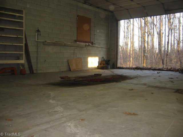 5750 Loop Road Clemmons, NC 27012 - Photo 9 of 9 Other. One Bay has Hydraulic lift built into the floor