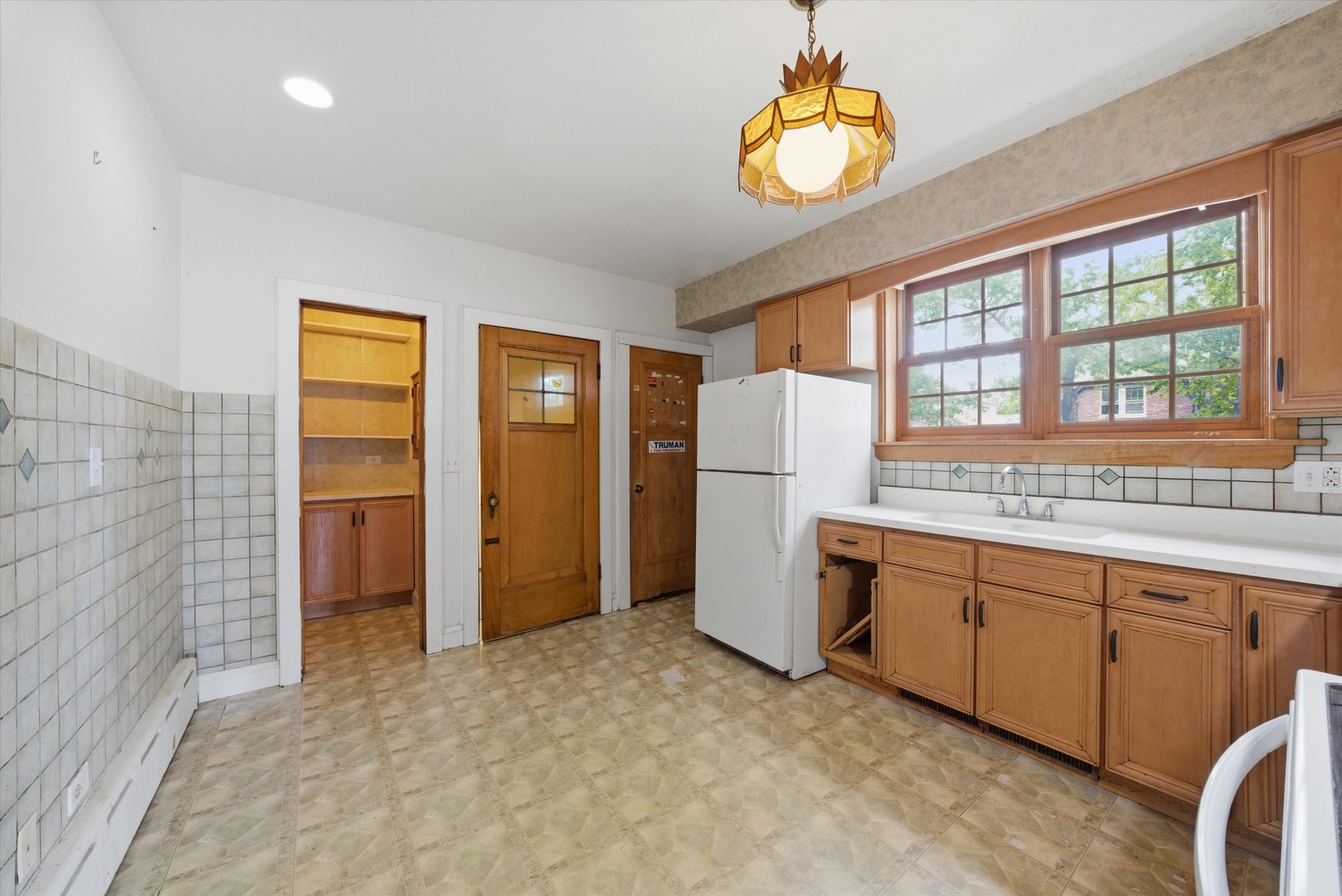 3100 Clinton Avenue Berwyn, IL 60402 - Photo 8 of 25 a room with refrigerator and window
