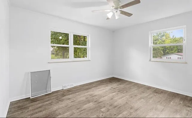 a view of an empty room with a window