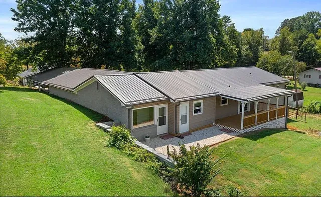 a aerial view of a house with a yard