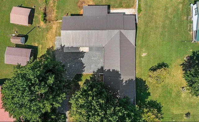 a view of a back yard from a balcony