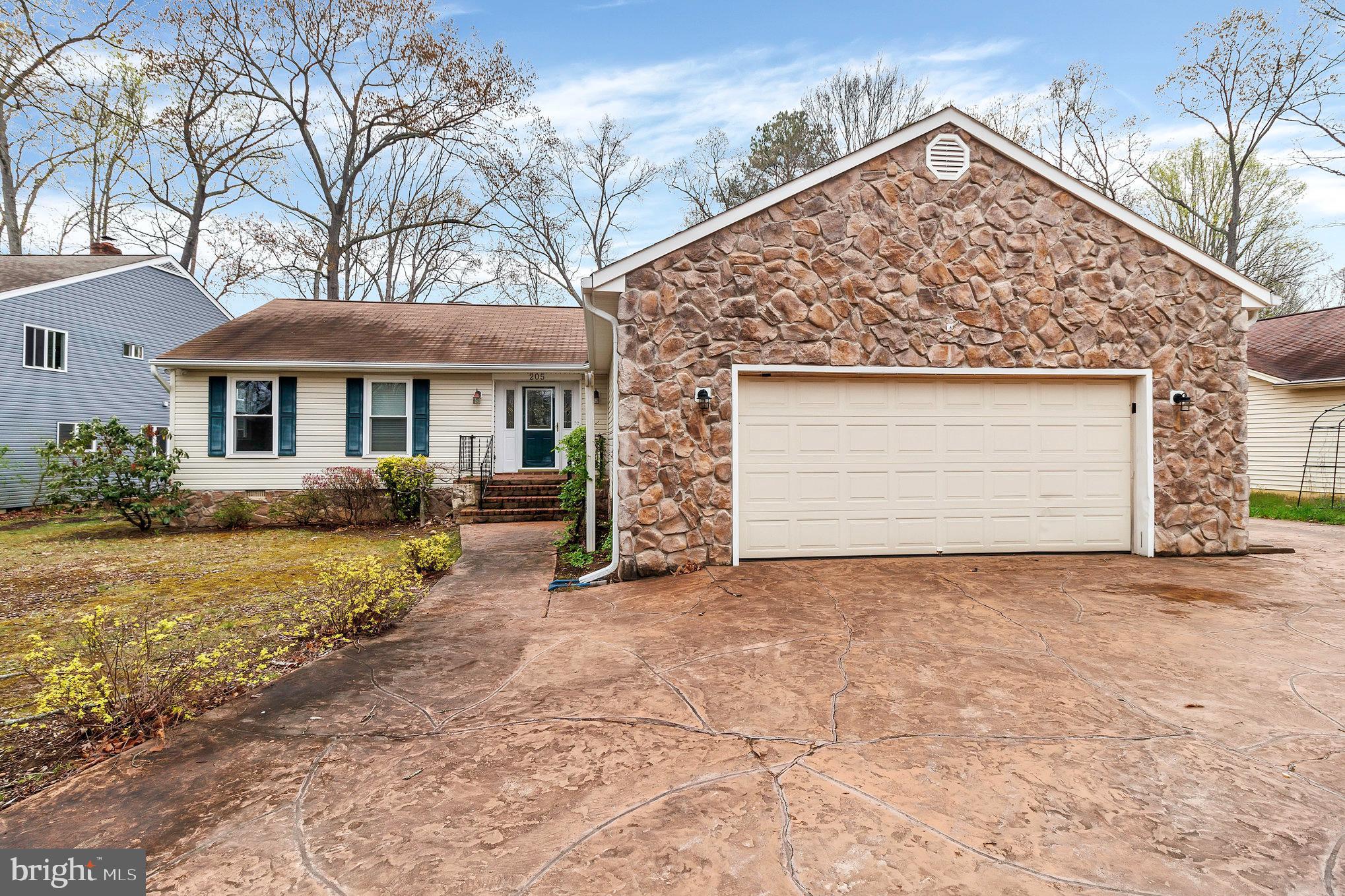205 Fairway Drive Locust Grove, VA 22508 - Photo 3 of 26 a view of a house with a yard and garage