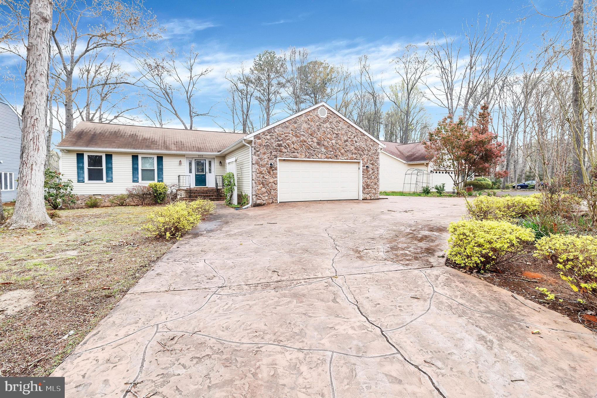 205 Fairway Drive Locust Grove, VA 22508 - Photo 4 of 26 a front view of a house with a yard and trees