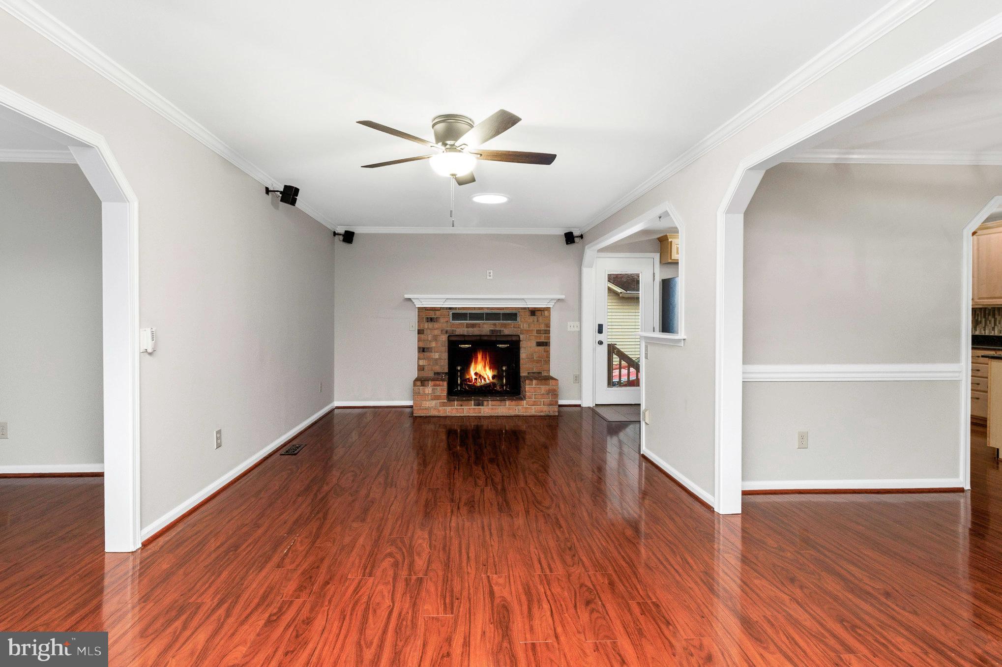 205 Fairway Drive Locust Grove, VA 22508 - Photo 7 of 26 a view of empty room with wooden floor and fireplace