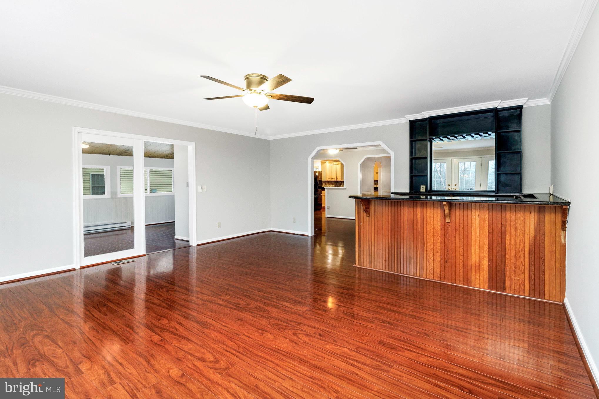 205 Fairway Drive Locust Grove, VA 22508 - Photo 8 of 26 a view of empty room with wooden floor and fan
