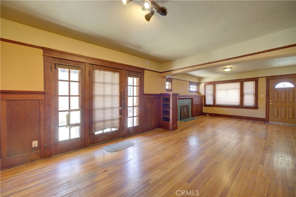 4579 11th Street Guadalupe, CA 93434 - Photo 12 of 40 a view of an empty room with a window and wooden floor