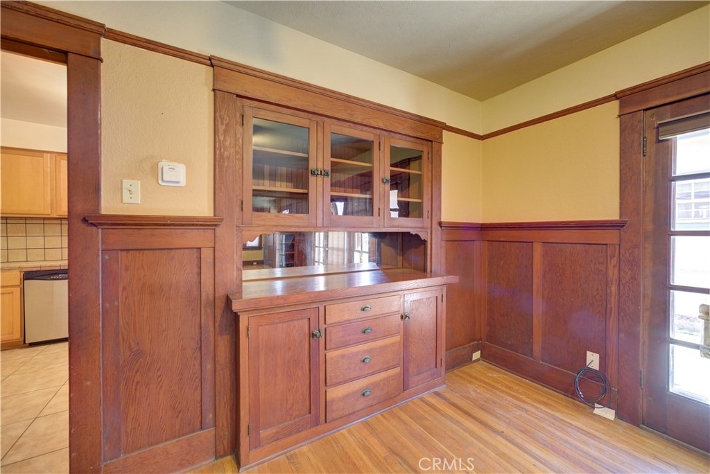 4579 11th Street Guadalupe, CA 93434 - Photo 13 of 40 a kitchen with a wooden cabinets and a window