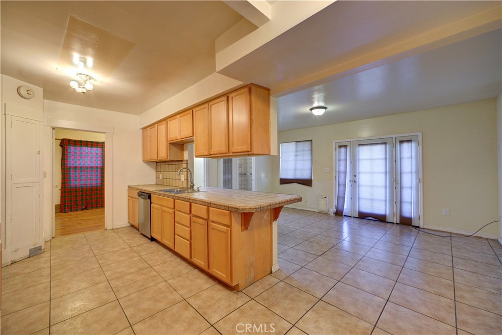 4579 11th Street Guadalupe, CA 93434 - Photo 16 of 40 a kitchen with stainless steel appliances granite countertop a stove a sink and a refrigerator