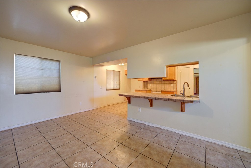 4579 11th Street Guadalupe, CA 93434 - Photo 19 of 40 a living room with a table
